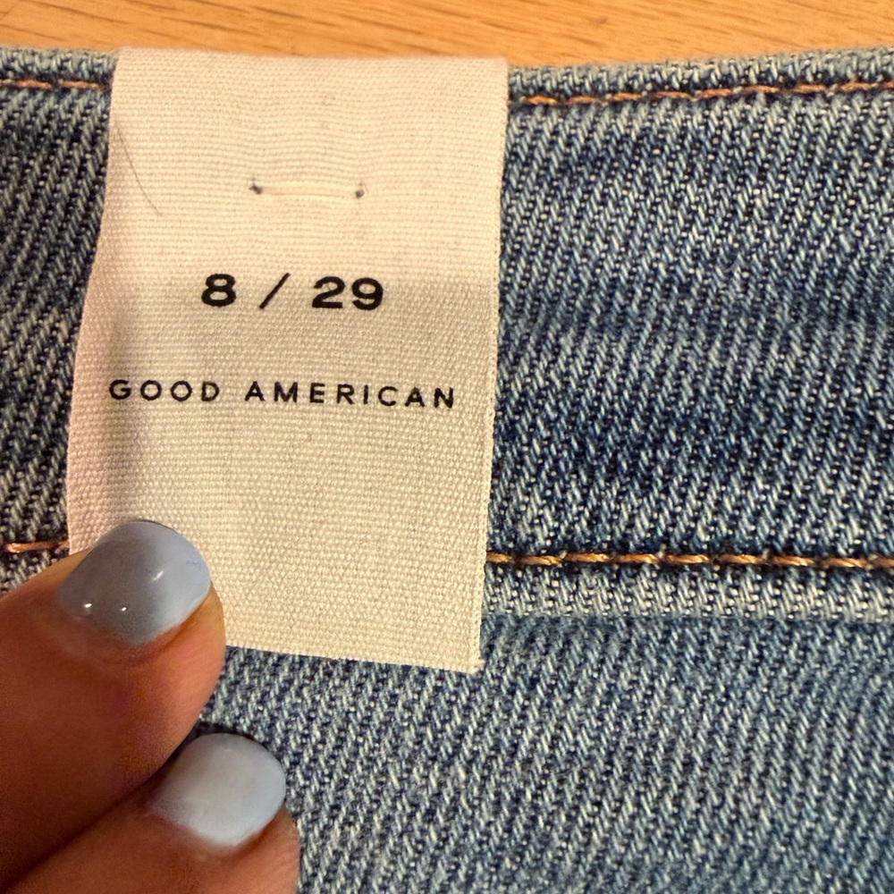 Good American Denim Bermuda Shorts in Medium Blue with Frayed Hem - Picture 6 of 7